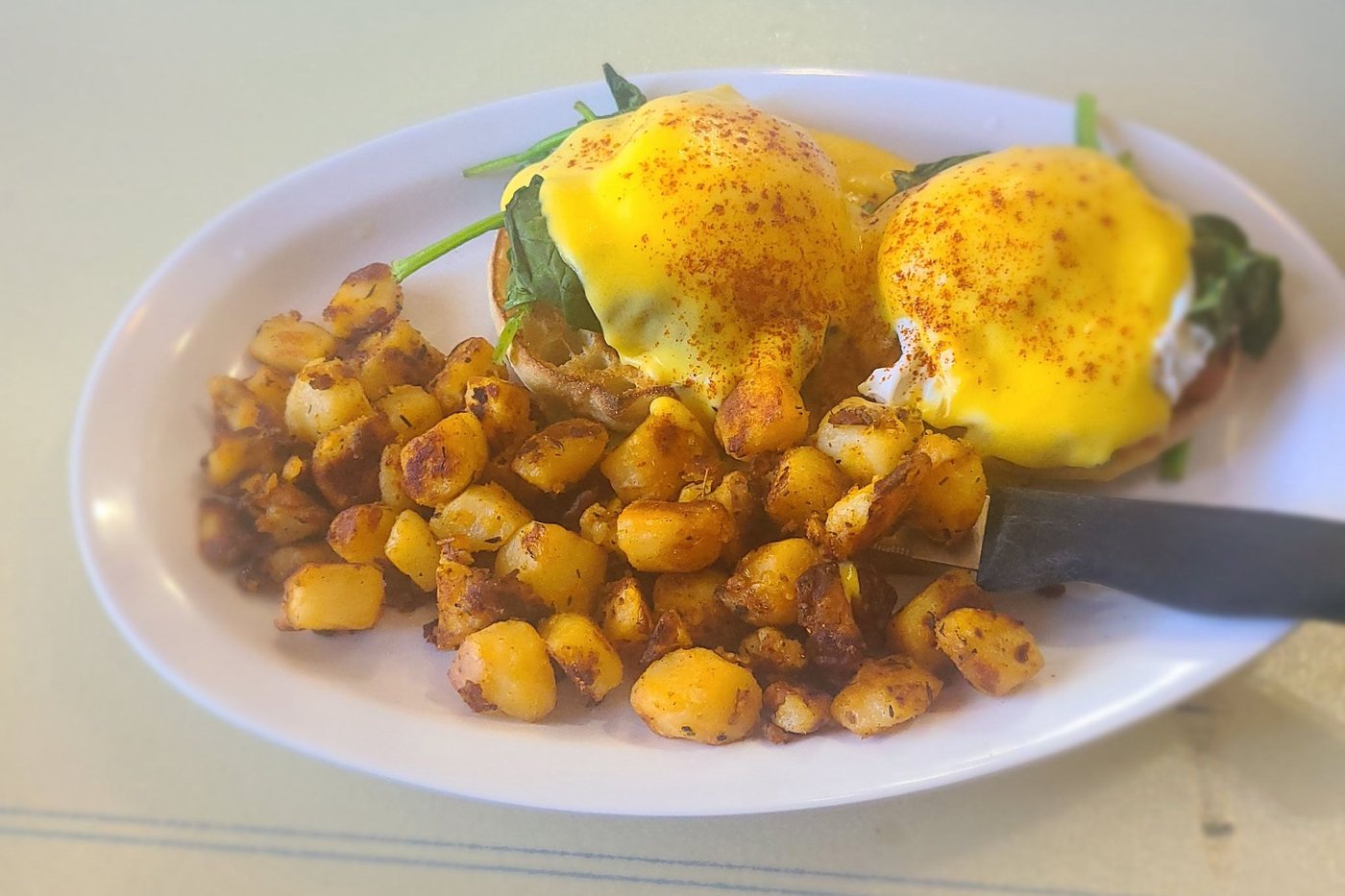 The Florentine Benedict — spinach, hollandaise and seasoned potatoes